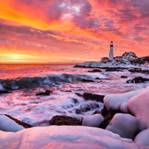 One of the most dramatic sunrises I've ever seen happened this morning. The rocks in the foreground were coated in ice from a recent winter storm and the waves coming in were huge. The light in the sky was absolutely incandescent.