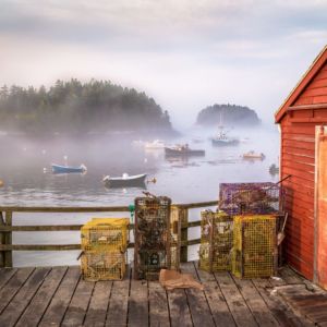 The Georgetown Town Wharf and Five Islands Lobster Co. provide one of the most picturesque setting in Maine. On this morning a low fog hung around the islands and boats moored in the harbor as the rising sun lit everything around in a golden glow.